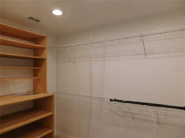 a view of an empty walk in closet