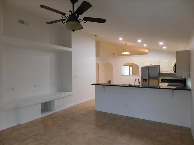 a view of a kitchen with a sink and a window