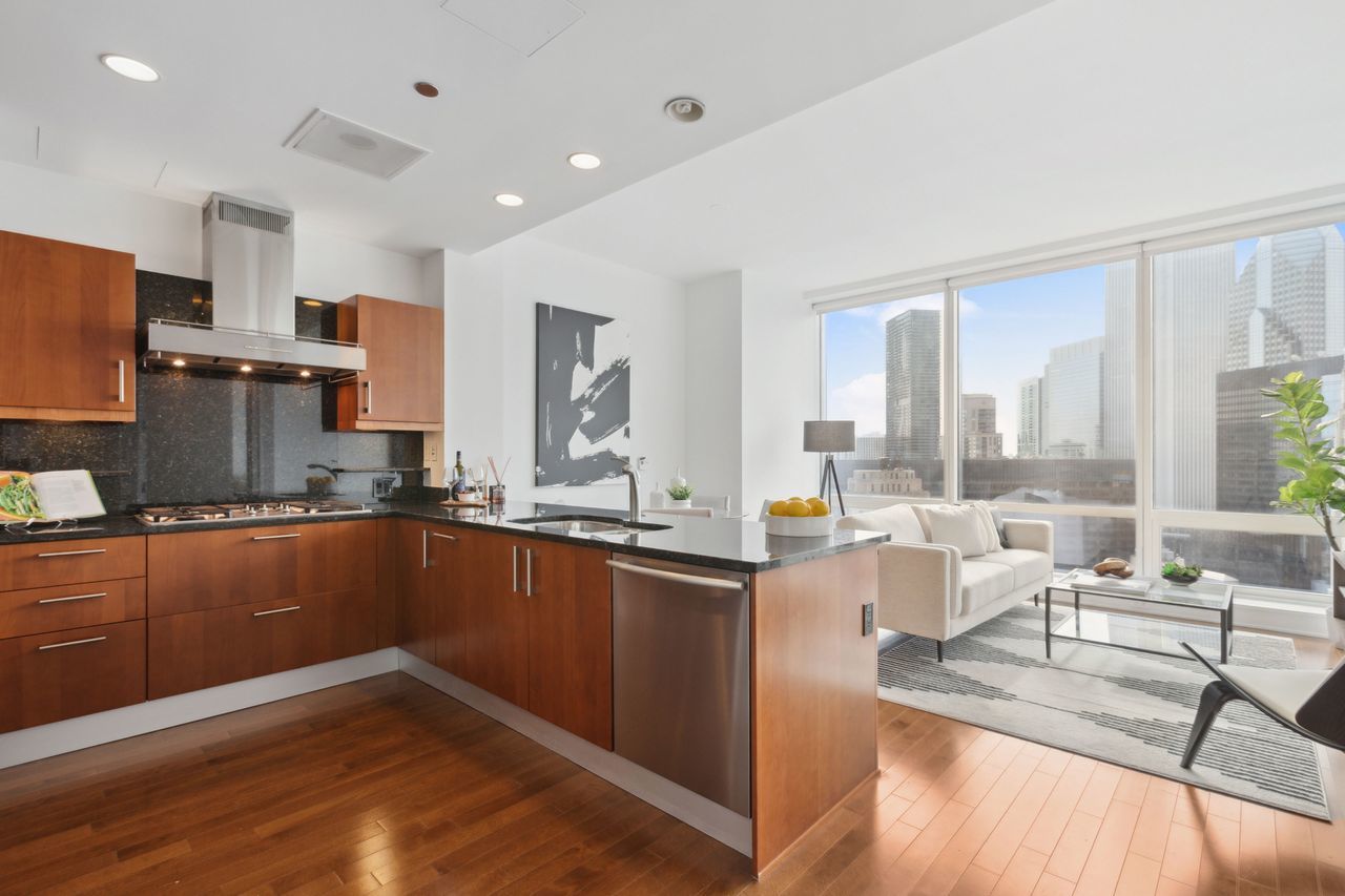 401 North Wabash Avenue, Unit 30I Chicago, IL 60611 - Photo 14 of 49 a kitchen with stainless steel appliances granite countertop a sink stove and cabinets