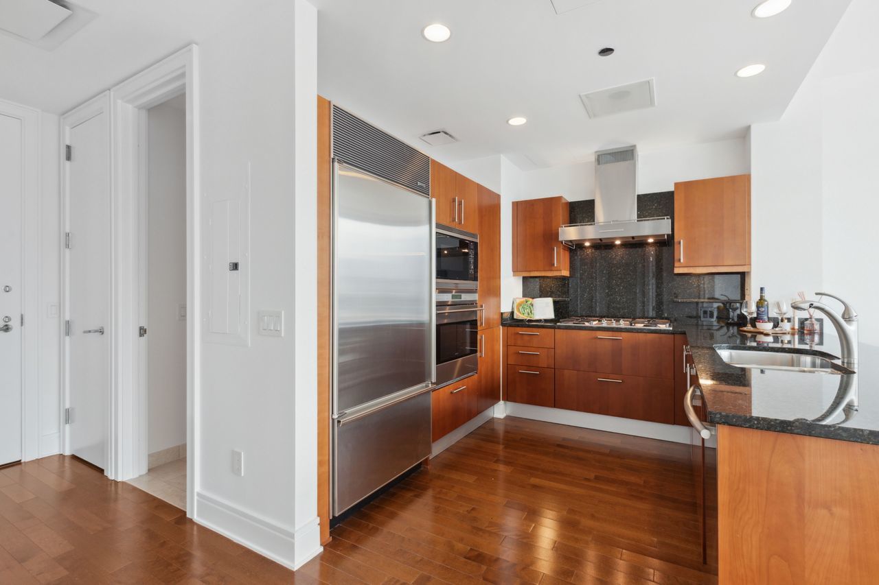 401 North Wabash Avenue, Unit 30I Chicago, IL 60611 - Photo 16 of 49 a kitchen with stainless steel appliances granite countertop a refrigerator and a sink