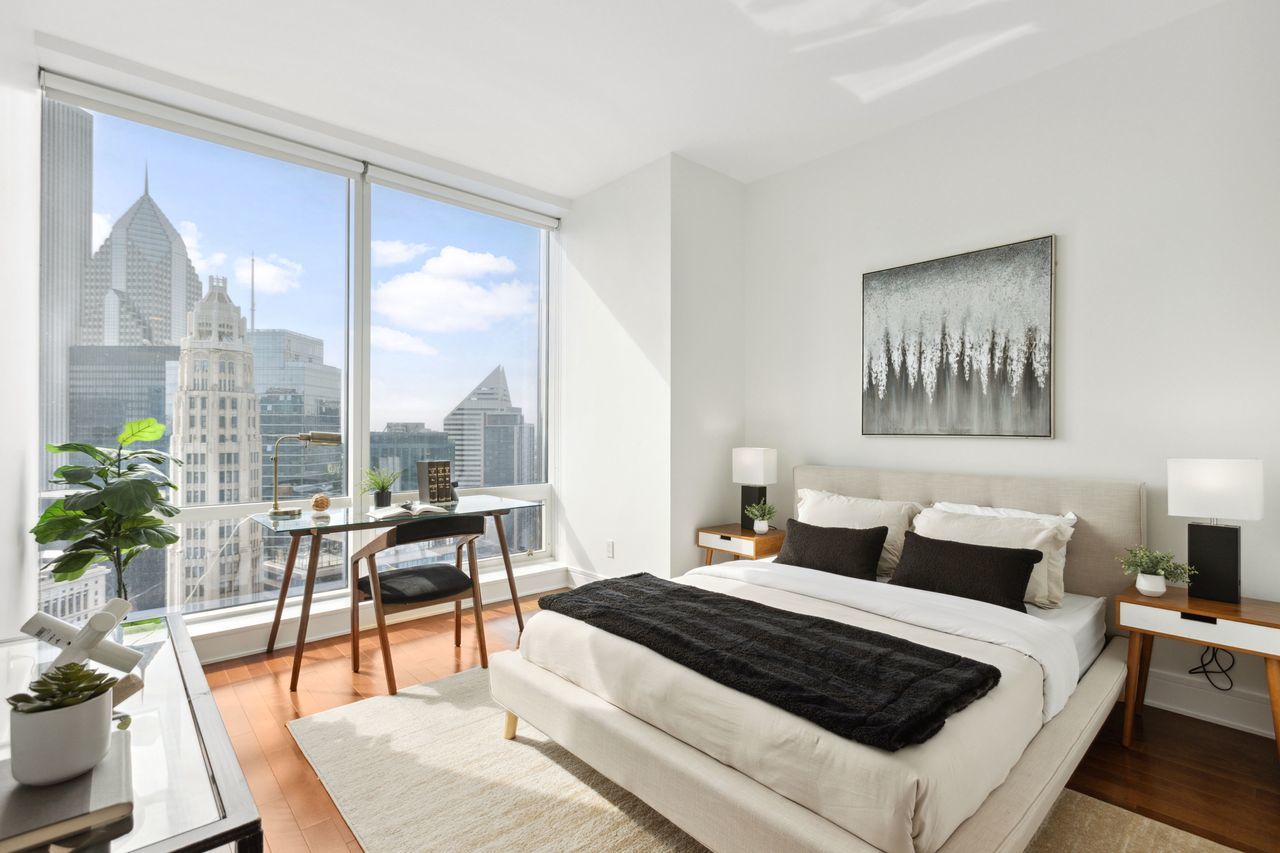 401 North Wabash Avenue, Unit 30I Chicago, IL 60611 - Photo 19 of 49 a bedroom with a large bed and a large window