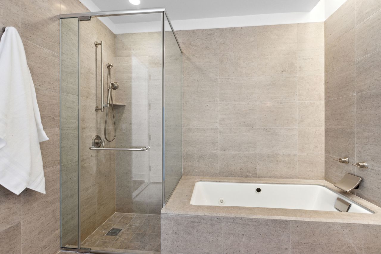 401 North Wabash Avenue, Unit 30I Chicago, IL 60611 - Photo 24 of 49 a bathroom with a tub a window and shower