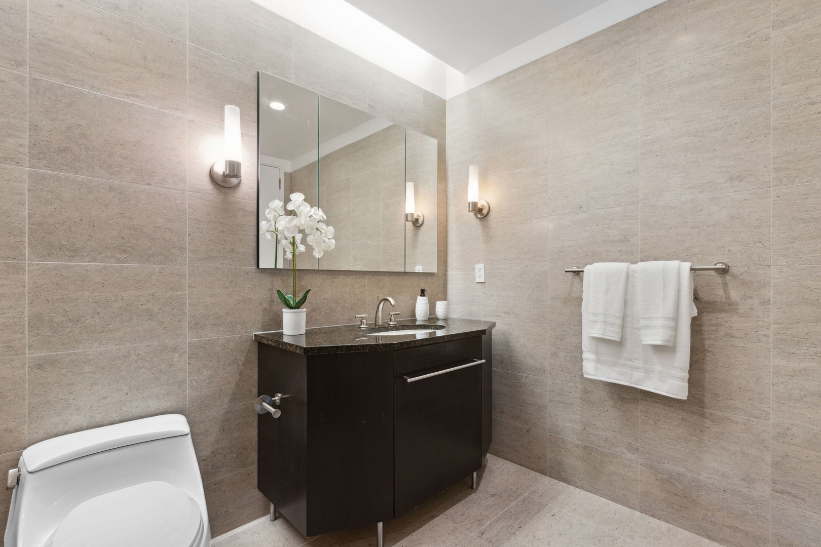 401 North Wabash Avenue, Unit 30I Chicago, IL 60611 - Photo 25 of 49 a bathroom with a granite countertop sink toilet and mirror