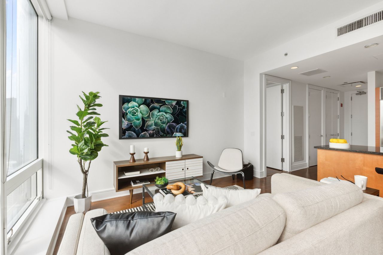 401 North Wabash Avenue, Unit 30I Chicago, IL 60611 - Photo 9 of 49 a living room with furniture and a flat screen tv