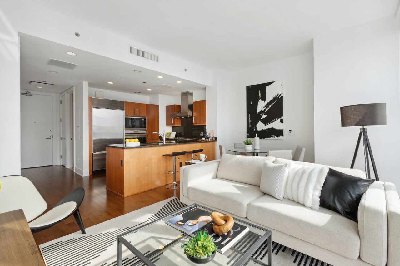 401 North Wabash Avenue, Unit 30I Chicago, IL 60611 - Photo 10 of 49 a living room with furniture and a dining table with kitchen view