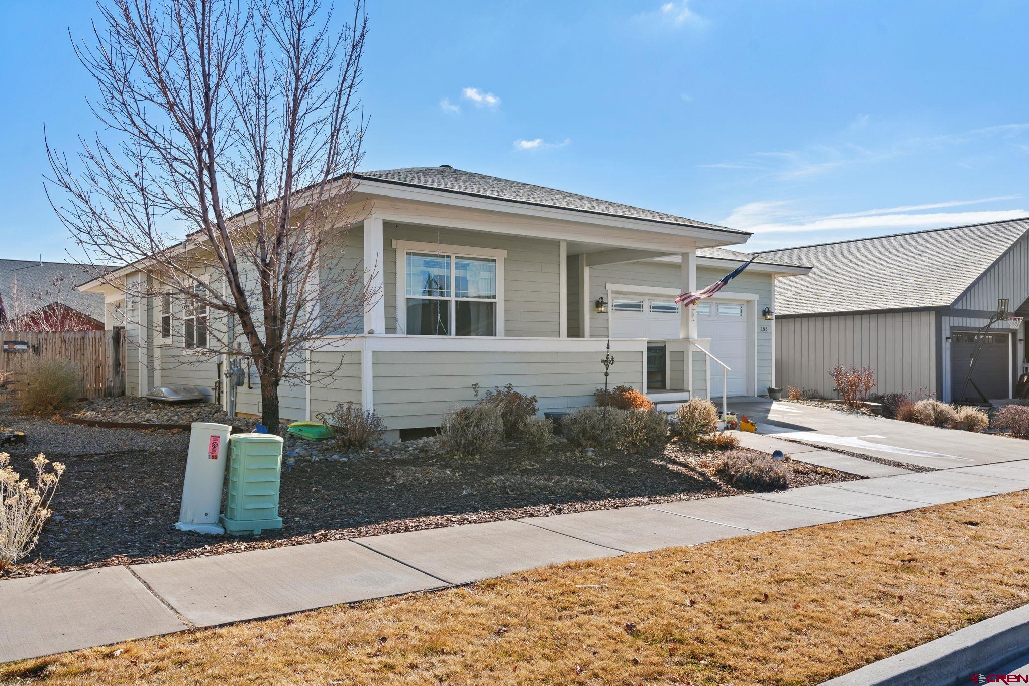 155 Prospector Avenue Durango, CO 81301 - Photo 1 of 35 a front view of a house with garden