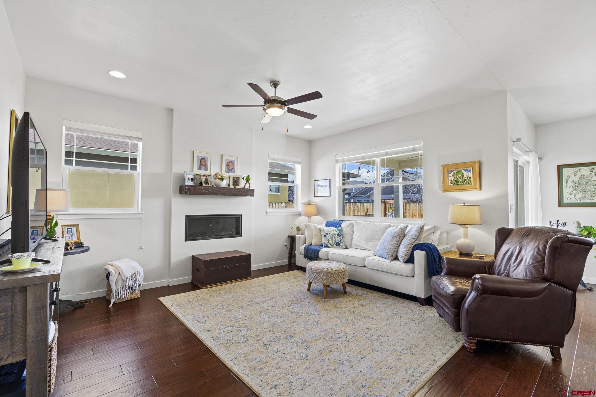 155 Prospector Avenue Durango, CO 81301 - Photo 11 of 35 a living room with furniture fireplace and a large window