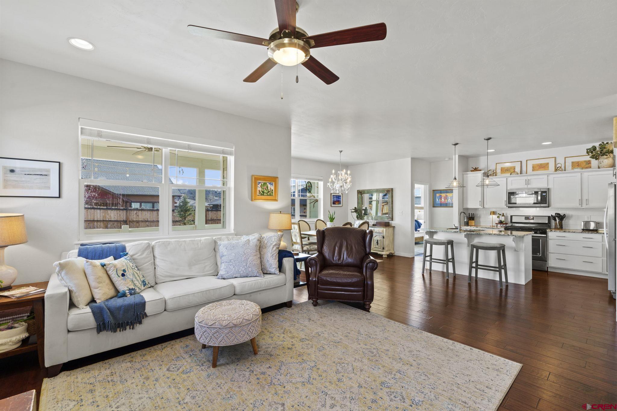 155 Prospector Avenue Durango, CO 81301 - Photo 12 of 35 a living room with furniture kitchen view and a large window