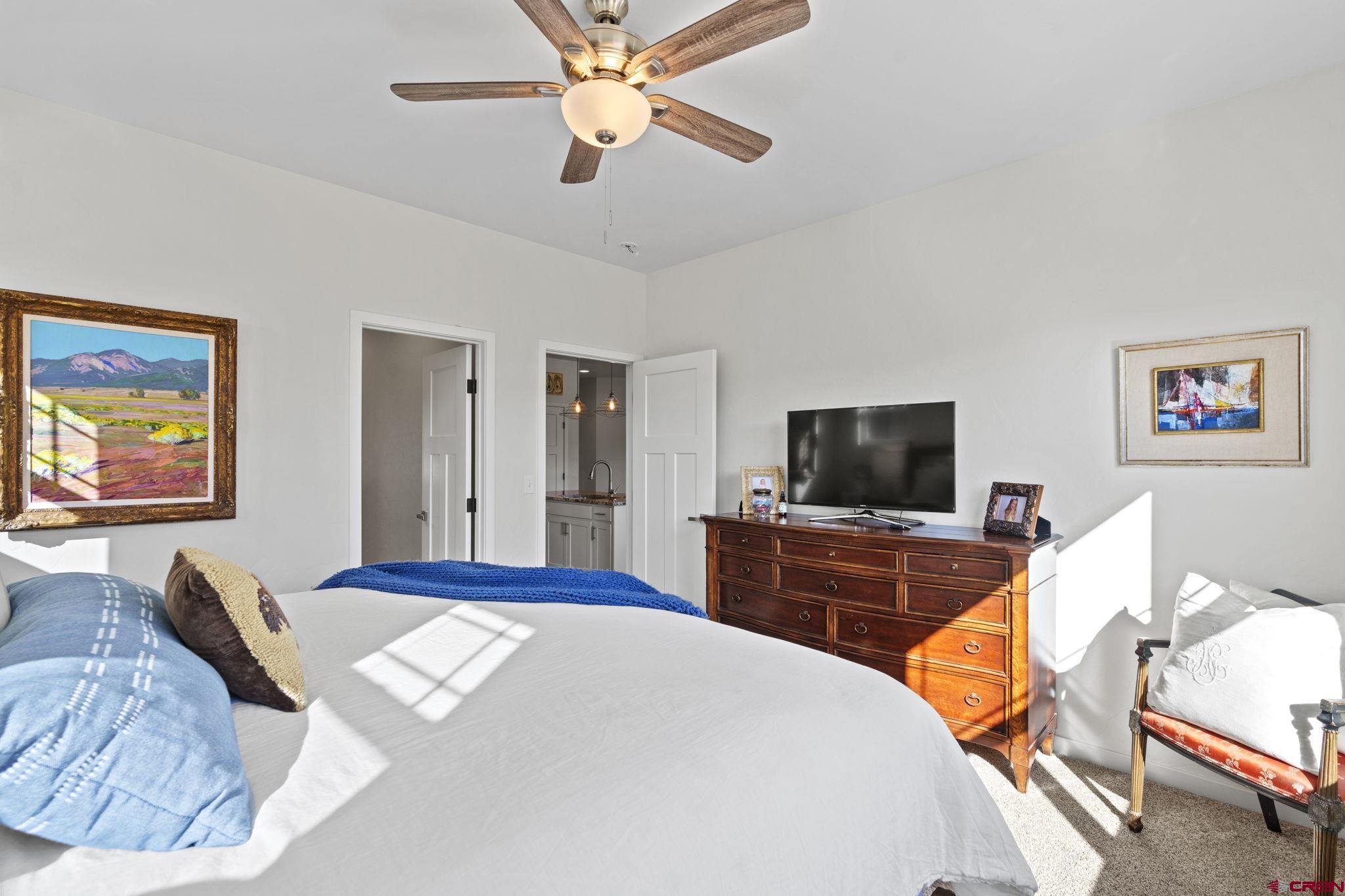 155 Prospector Avenue Durango, CO 81301 - Photo 16 of 35 a bedroom with a bed and a flat screen tv