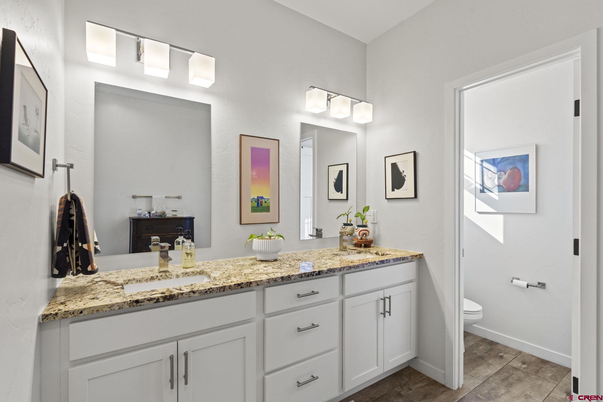155 Prospector Avenue Durango, CO 81301 - Photo 18 of 35 a bathroom with double sink and a mirror