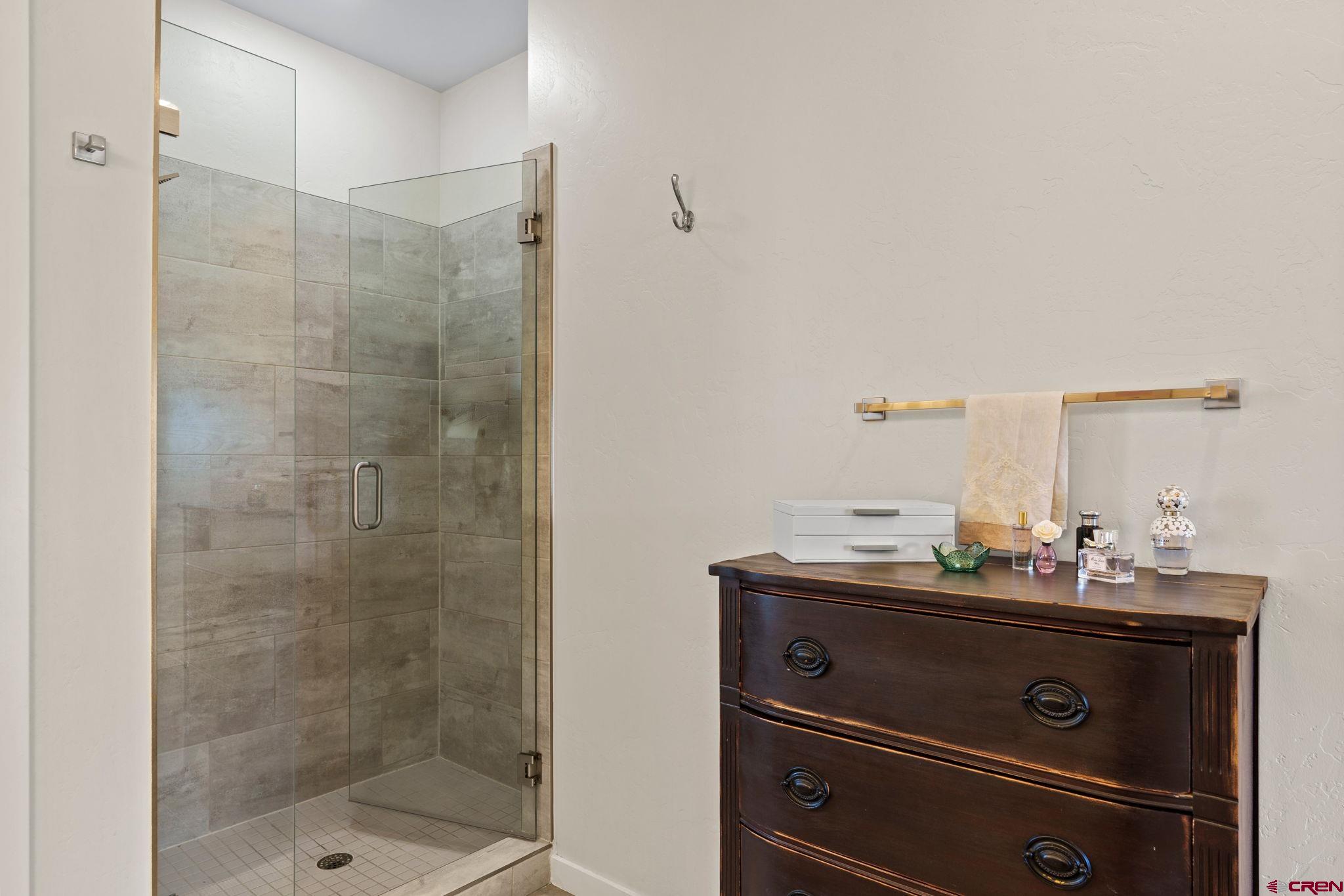155 Prospector Avenue Durango, CO 81301 - Photo 20 of 35 a bathroom with a shower curtain