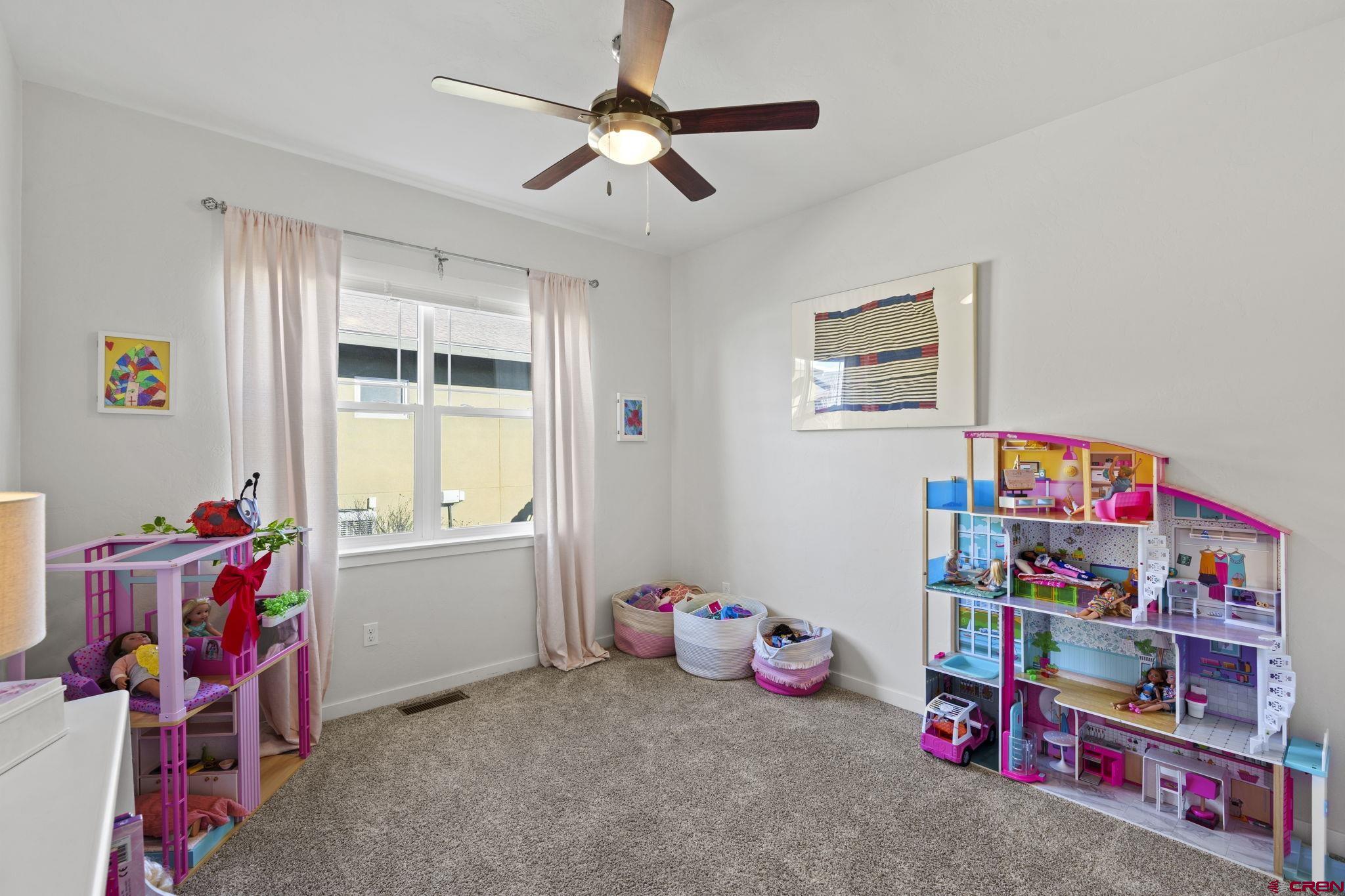 155 Prospector Avenue Durango, CO 81301 - Photo 25 of 35 a children room with toys and a wooden floor