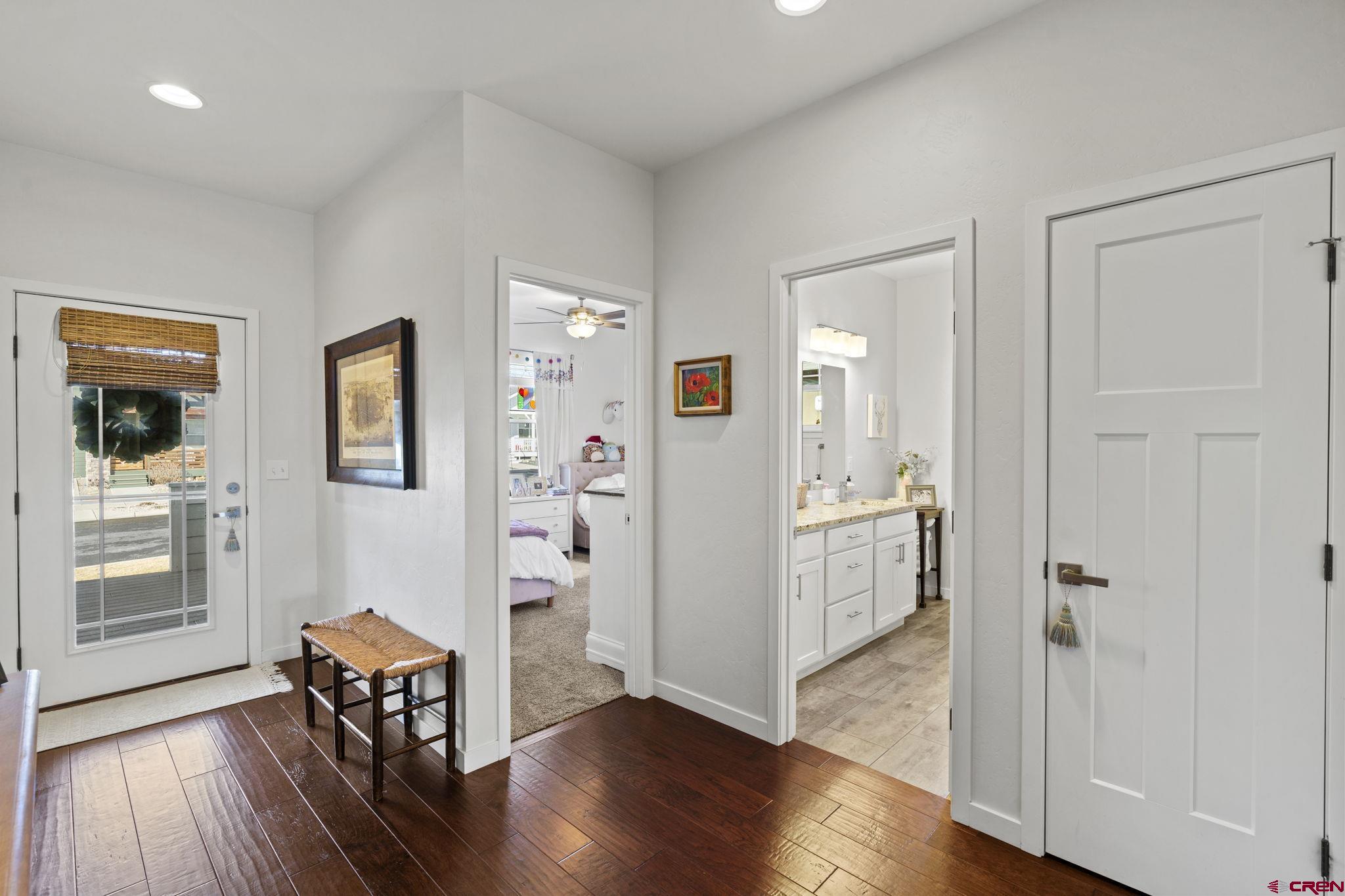 155 Prospector Avenue Durango, CO 81301 - Photo 3 of 35 wooden floor in an empty room with a window and wooden floor