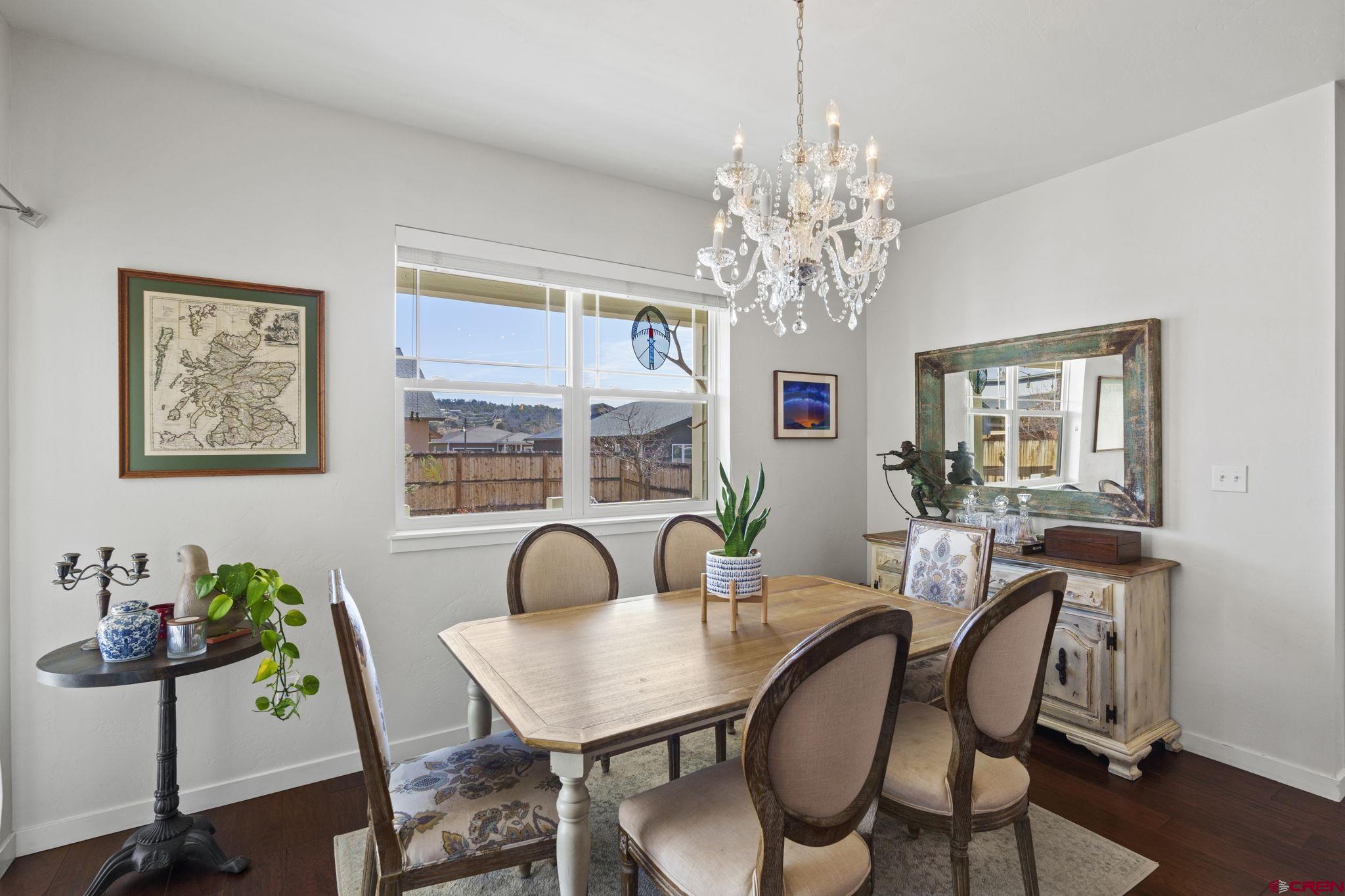155 Prospector Avenue Durango, CO 81301 - Photo 9 of 35 a view of a dining room with furniture window and wooden floor