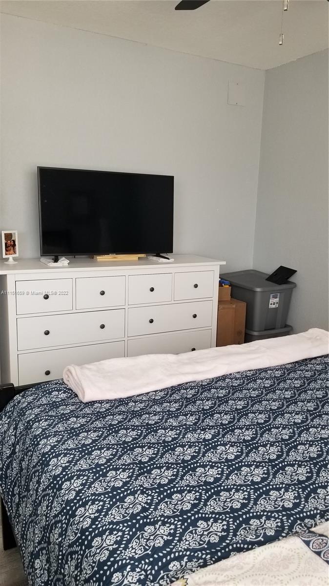 11368 Taft Street, Unit 11368 Pembroke Pines, FL 33026 - Photo 13 of 20 a bedroom with a bed and window