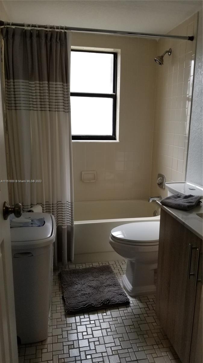 11368 Taft Street, Unit 11368 Pembroke Pines, FL 33026 - Photo 10 of 20 a bathroom with a sink toilet and shower