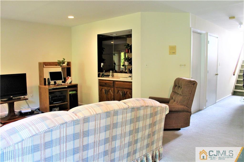 3904 Springbrook Drive, Unit 3904 Edison, NJ 08820 - Photo 14 of 25 a bedroom with a bed and furniture