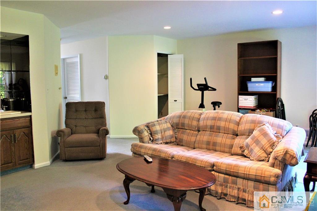 3904 Springbrook Drive, Unit 3904 Edison, NJ 08820 - Photo 15 of 25 a bedroom with furniture and a couch