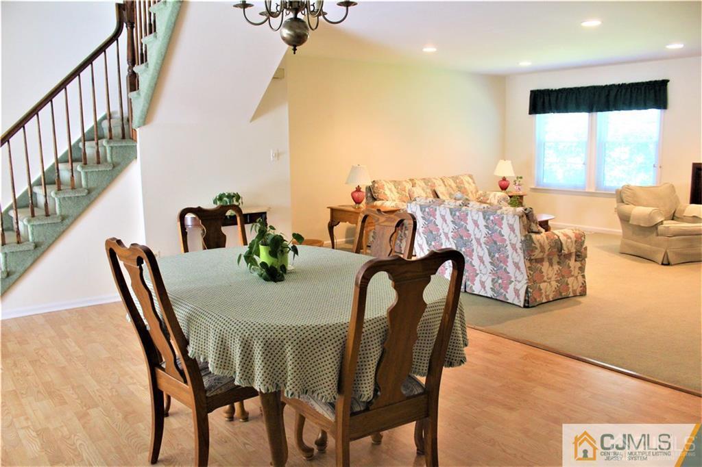 3904 Springbrook Drive, Unit 3904 Edison, NJ 08820 - Photo 8 of 25 a view of a dining room with furniture and a large window