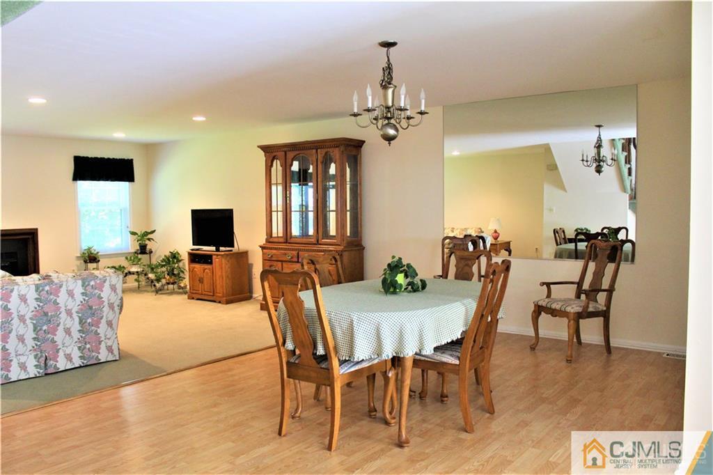 3904 Springbrook Drive, Unit 3904 Edison, NJ 08820 - Photo 9 of 25 a view of a dining room with furniture