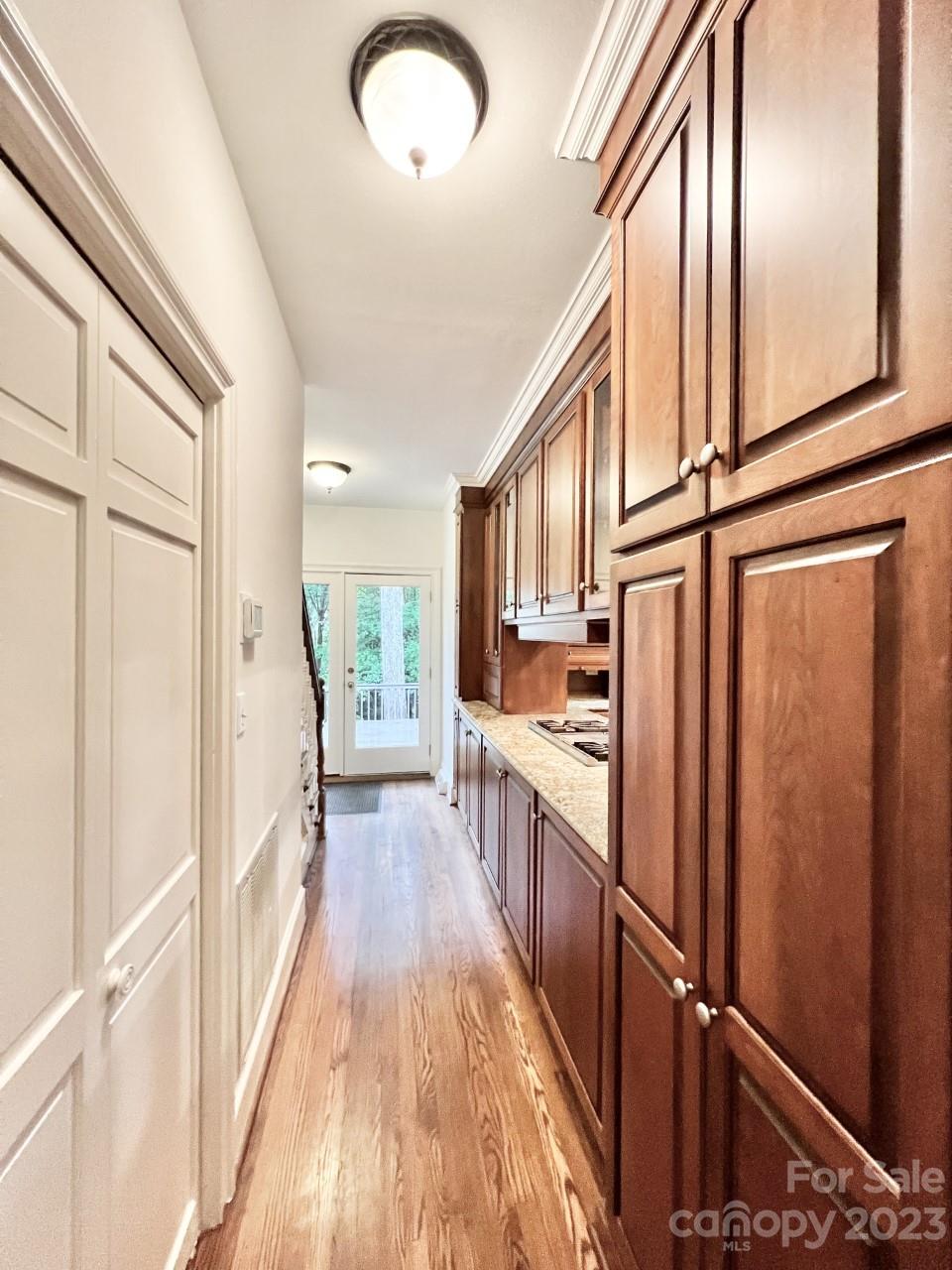 5614 Laurium Road Charlotte, NC 28226 - Photo 13 of 40 a view of a kitchen with wooden floor and electronic appliances