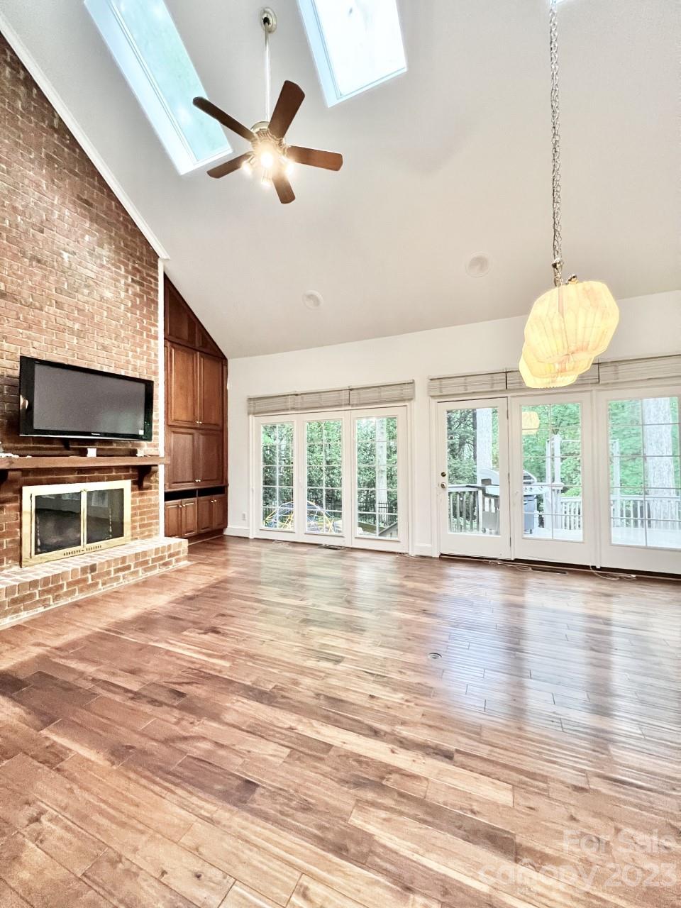 5614 Laurium Road Charlotte, NC 28226 - Photo 16 of 40 a view of an empty room with wooden floor and a window