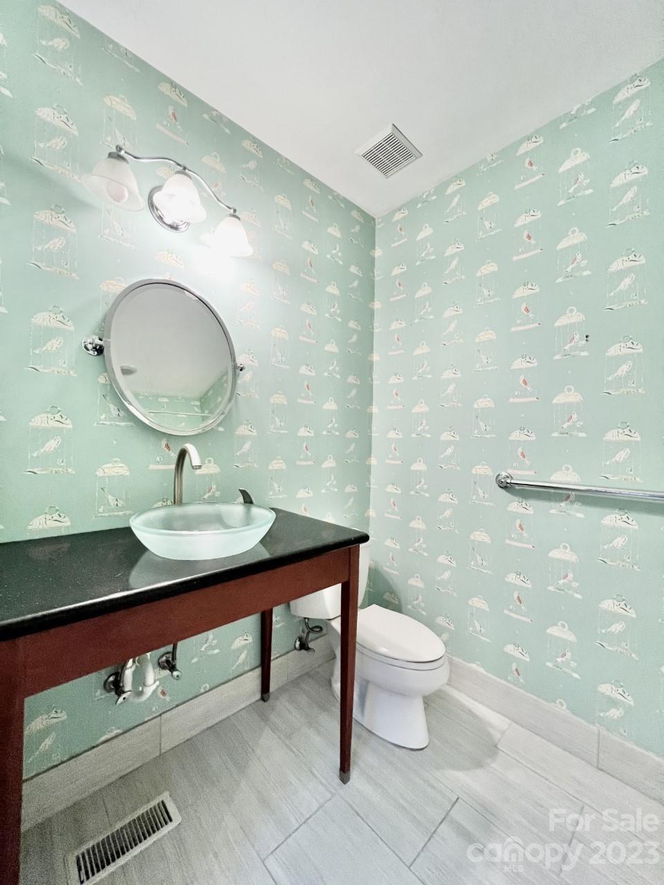 5614 Laurium Road Charlotte, NC 28226 - Photo 17 of 40 a bathroom with a sink a toilet and a mirror