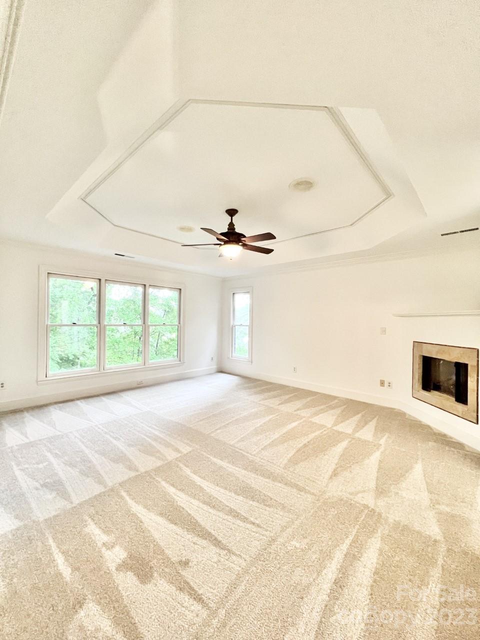 5614 Laurium Road Charlotte, NC 28226 - Photo 18 of 40 a view of an empty room with a fireplace and a window