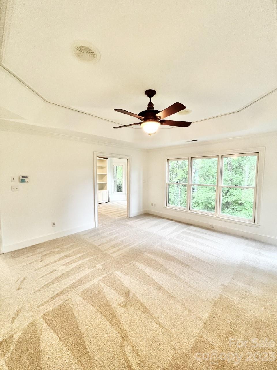 5614 Laurium Road Charlotte, NC 28226 - Photo 19 of 40 a view of a livingroom with a window and a ceiling fan