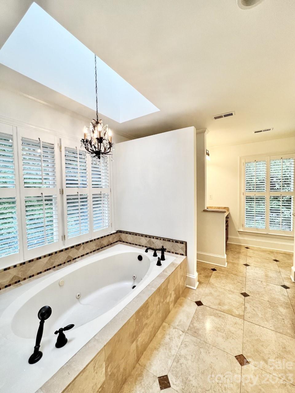 5614 Laurium Road Charlotte, NC 28226 - Photo 22 of 40 a bathroom with a tub a sink and a shower