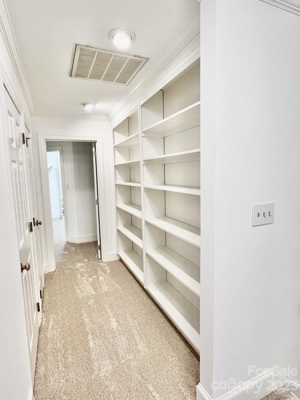 5614 Laurium Road Charlotte, NC 28226 - Photo 26 of 40 a view of an empty room with a cabinet