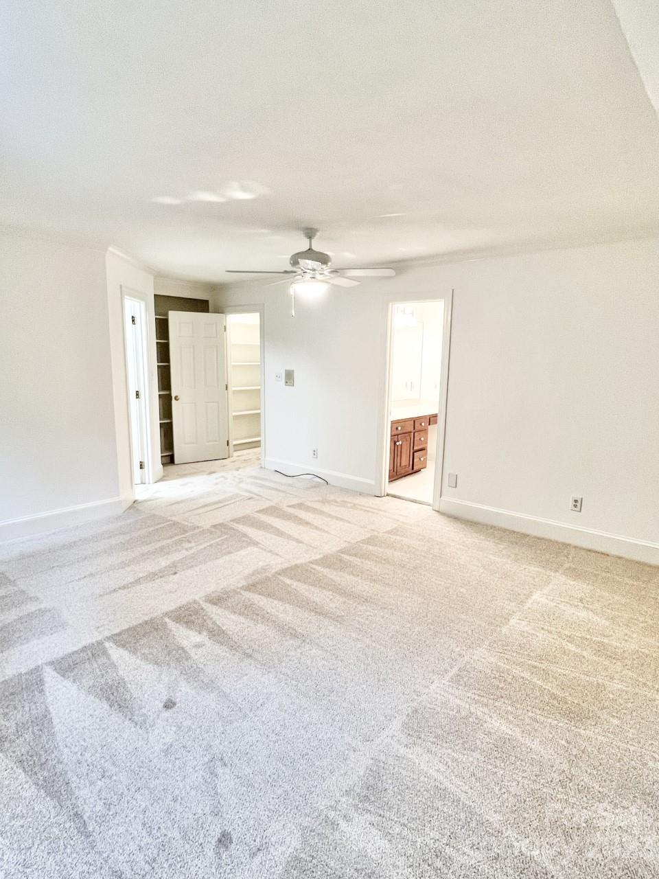 5614 Laurium Road Charlotte, NC 28226 - Photo 28 of 40 a view of a livingroom with a ceiling fan and window