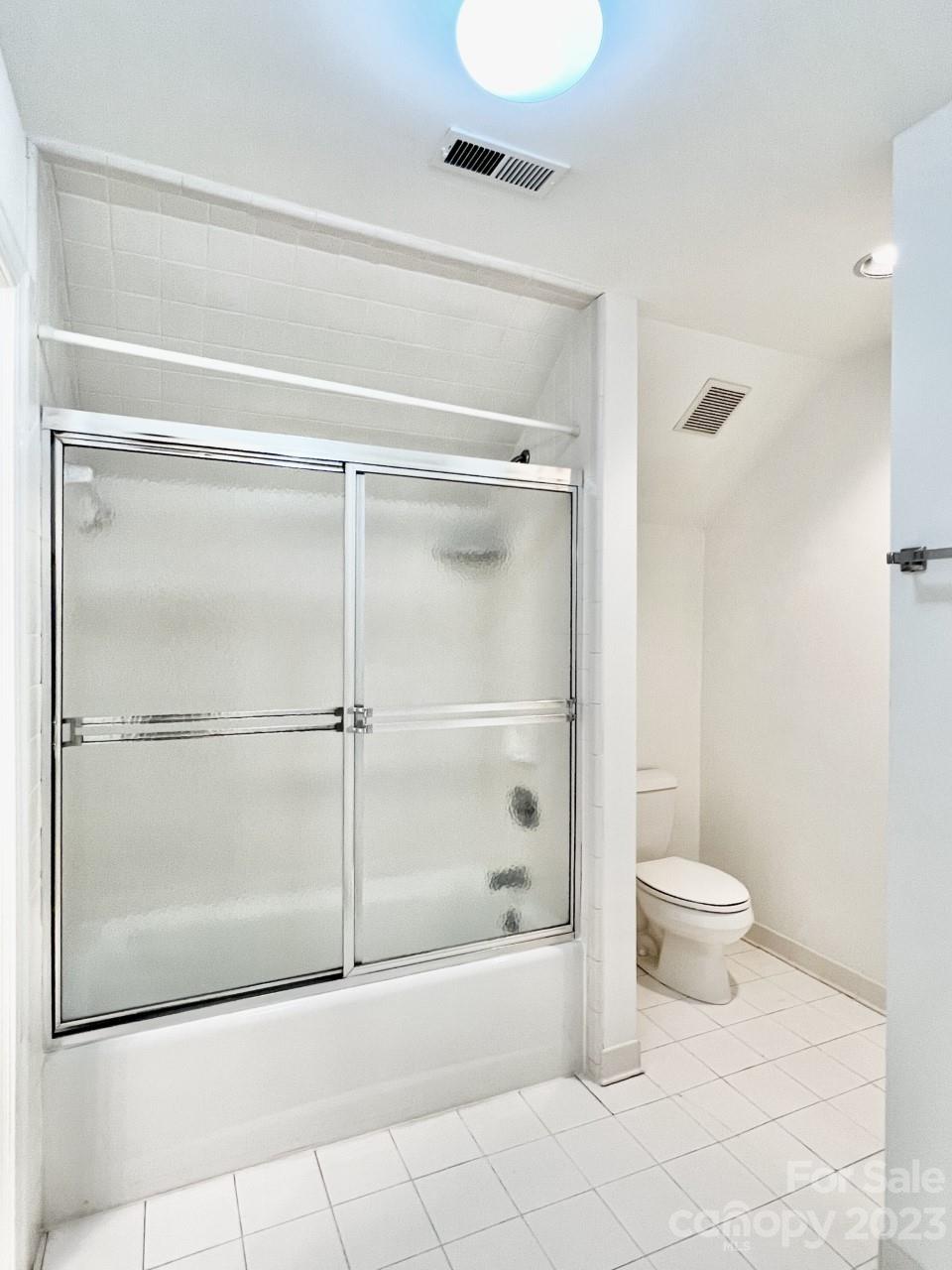 5614 Laurium Road Charlotte, NC 28226 - Photo 30 of 40 a bathroom with a shower and a toilet