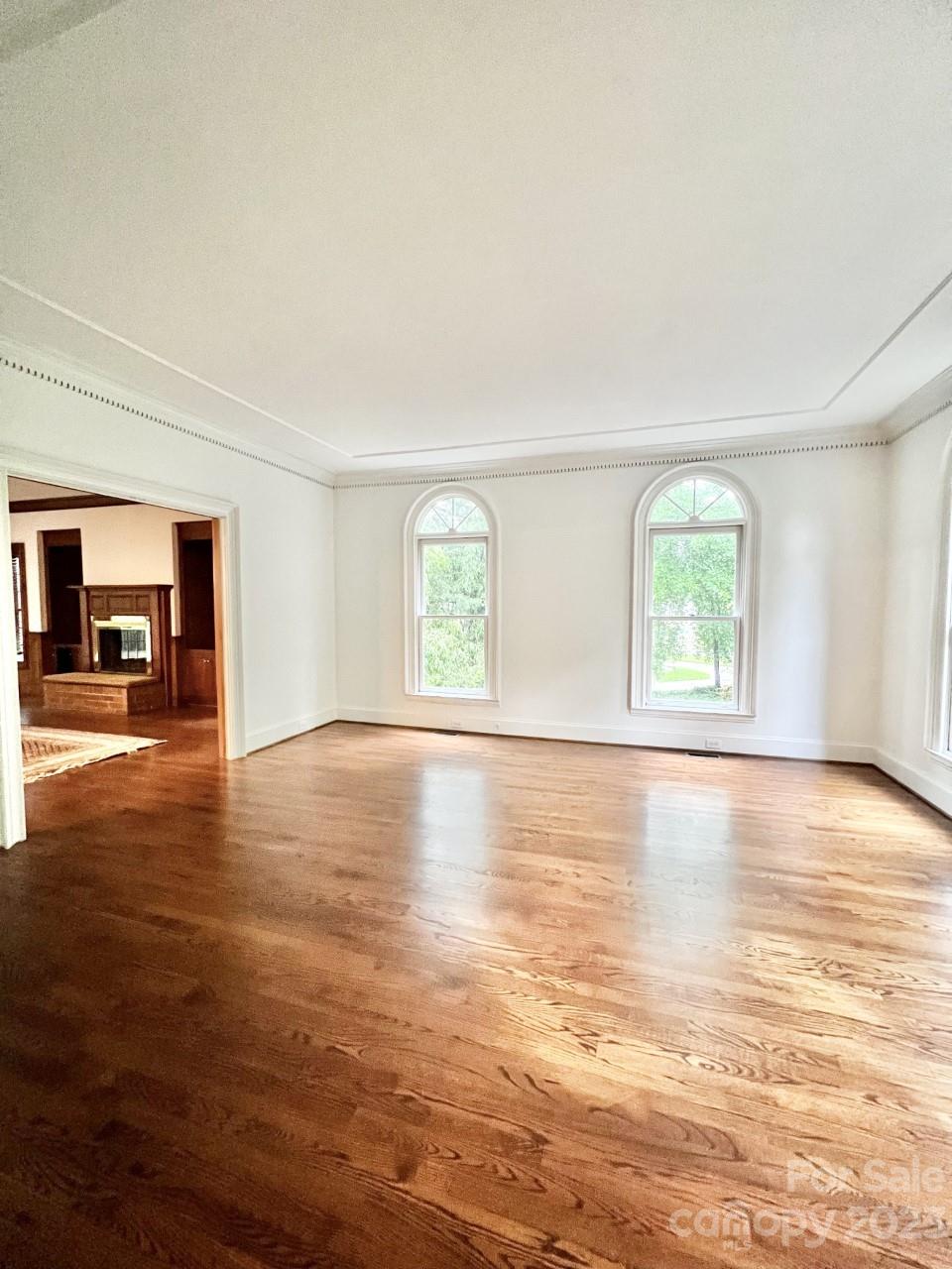 5614 Laurium Road Charlotte, NC 28226 - Photo 3 of 40 an empty room with wooden floor and windows
