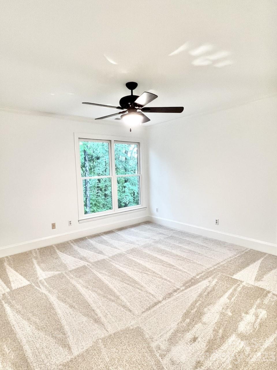 5614 Laurium Road Charlotte, NC 28226 - Photo 34 of 40 a view of an empty room with a window
