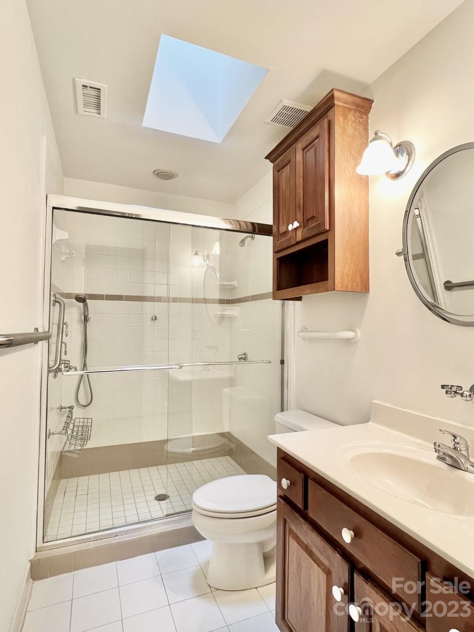 5614 Laurium Road Charlotte, NC 28226 - Photo 35 of 40 a bathroom with a sink a toilet and shower