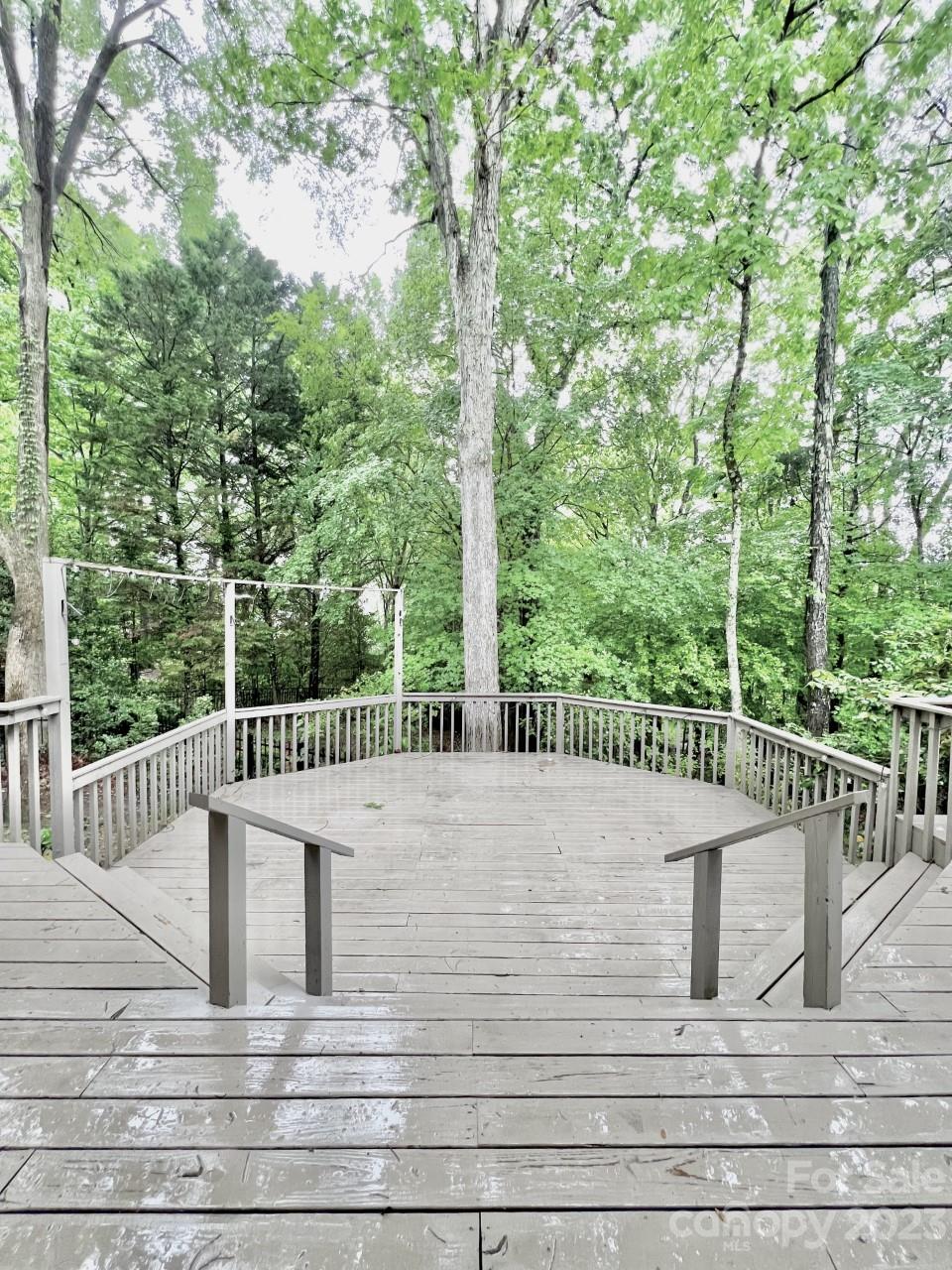 5614 Laurium Road Charlotte, NC 28226 - Photo 38 of 40 a view of a balcony with floor to ceiling window and wooden fence