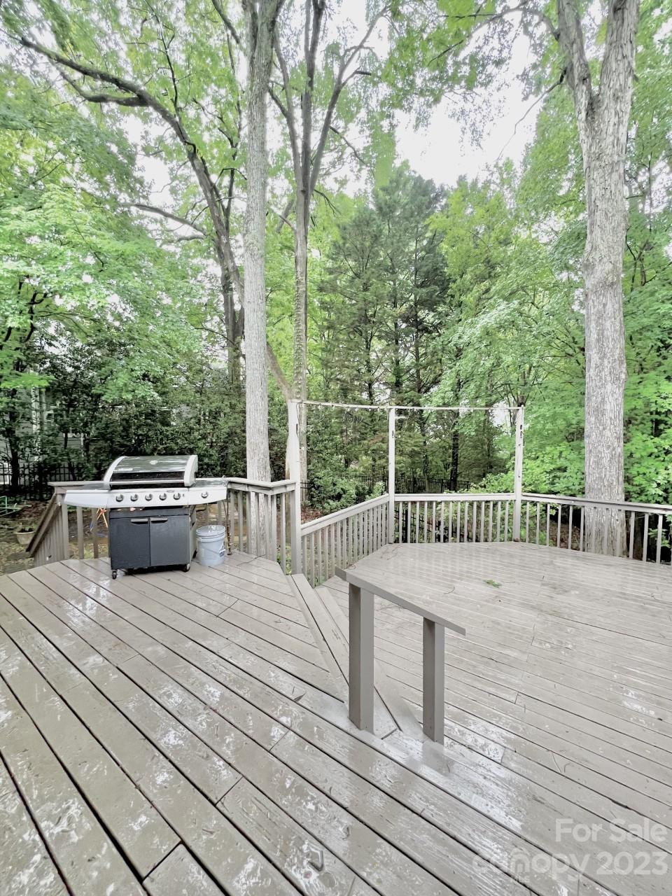 5614 Laurium Road Charlotte, NC 28226 - Photo 39 of 40 a view of a balcony with wooden floor and fence
