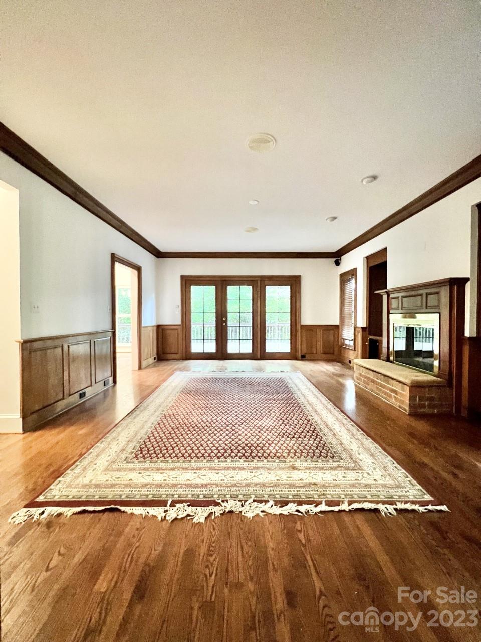 5614 Laurium Road Charlotte, NC 28226 - Photo 4 of 40 a view of a livingroom with a fireplace furniture and a large window