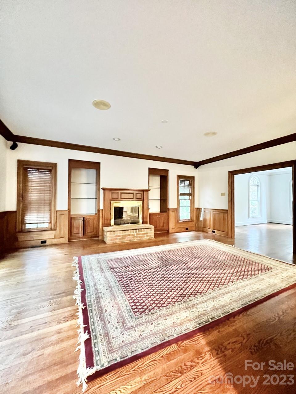 5614 Laurium Road Charlotte, NC 28226 - Photo 5 of 40 a spacious bedroom with a large bed and a large window
