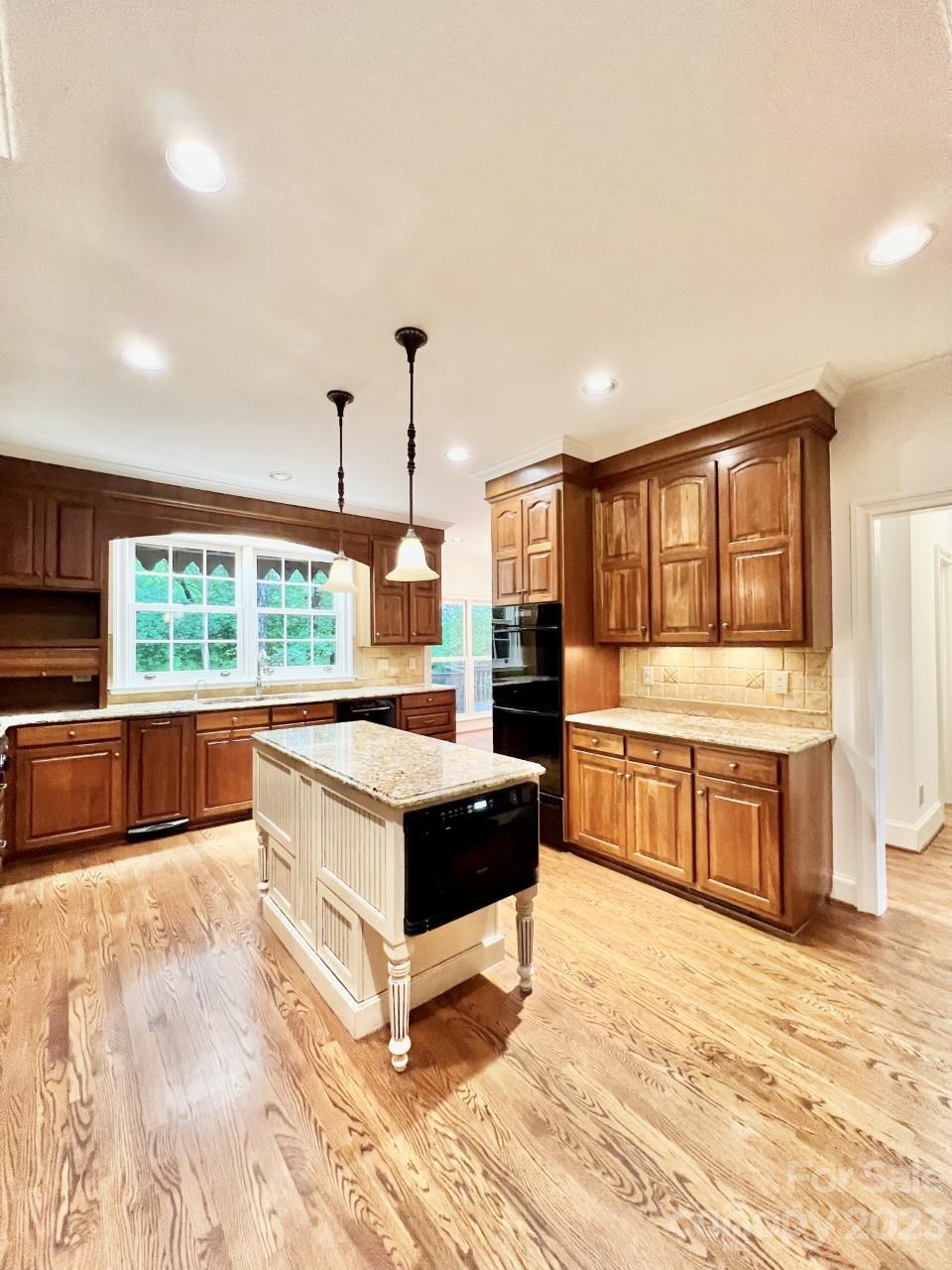 5614 Laurium Road Charlotte, NC 28226 - Photo 9 of 40 a kitchen with a stove sink and a large window