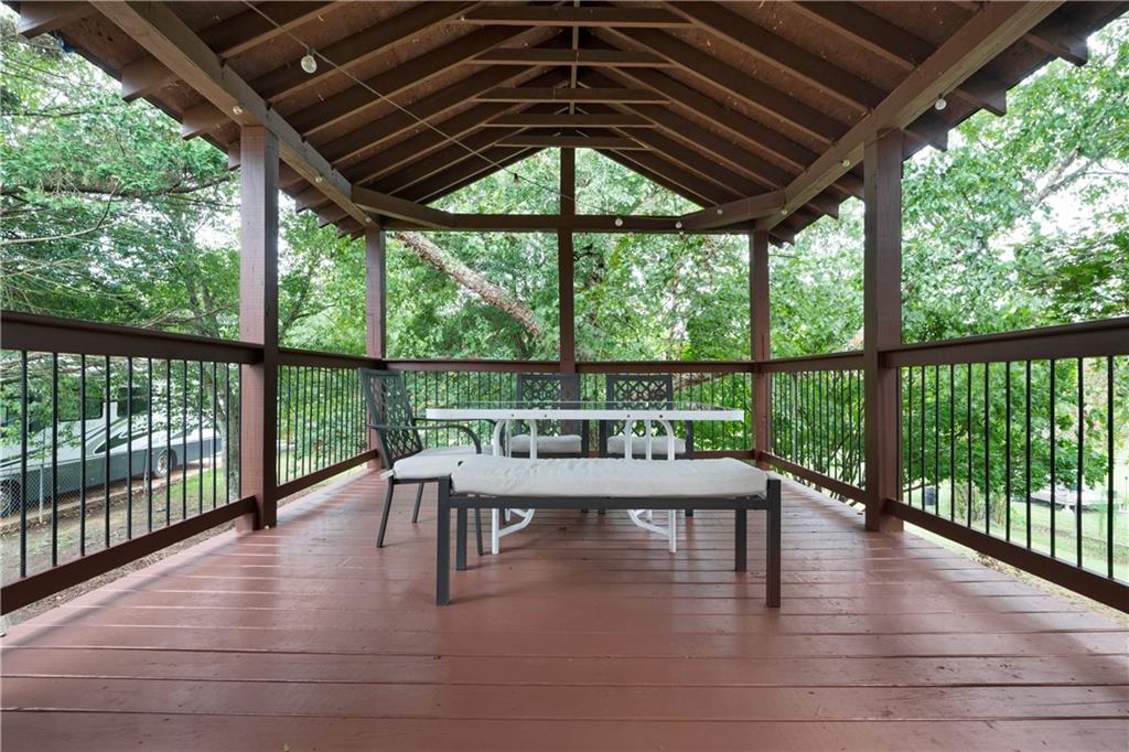 520 Brown Farm Road Southwest Cartersville, GA 30120 - Photo 14 of 16 a balcony with furniture and wooden floor
