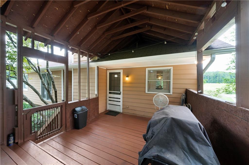 520 Brown Farm Road Southwest Cartersville, GA 30120 - Photo 15 of 16 a view of a porch with furniture and wooden floor