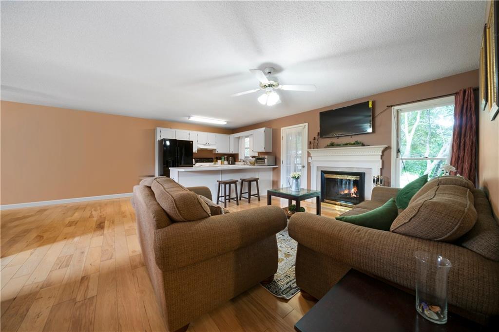 520 Brown Farm Road Southwest Cartersville, GA 30120 - Photo 3 of 16 a living room with furniture and a fireplace