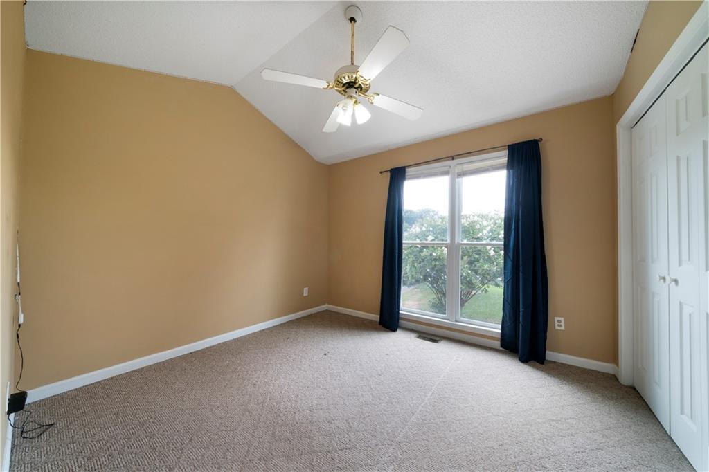 520 Brown Farm Road Southwest Cartersville, GA 30120 - Photo 9 of 16 a view of a livingroom with a ceiling fan and a large window