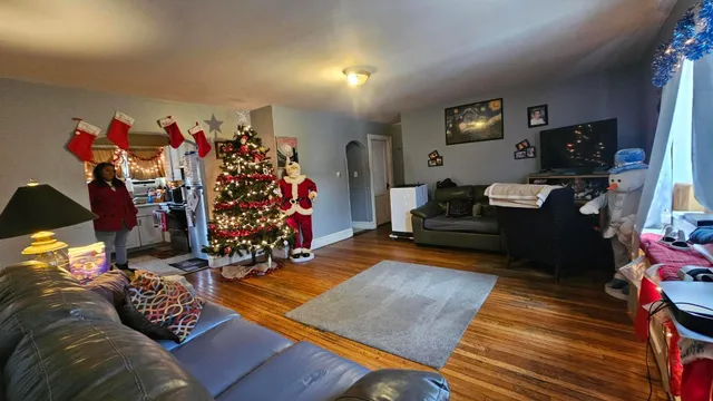 a view of a livingroom with workspace and a couch