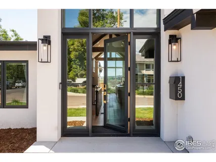 a view of a living room and a kitchen with furniture window
