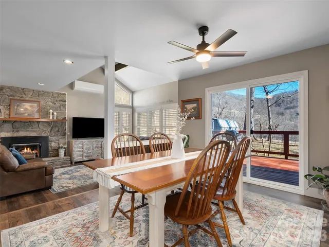 a dining room with furniture garden view and a fireplace