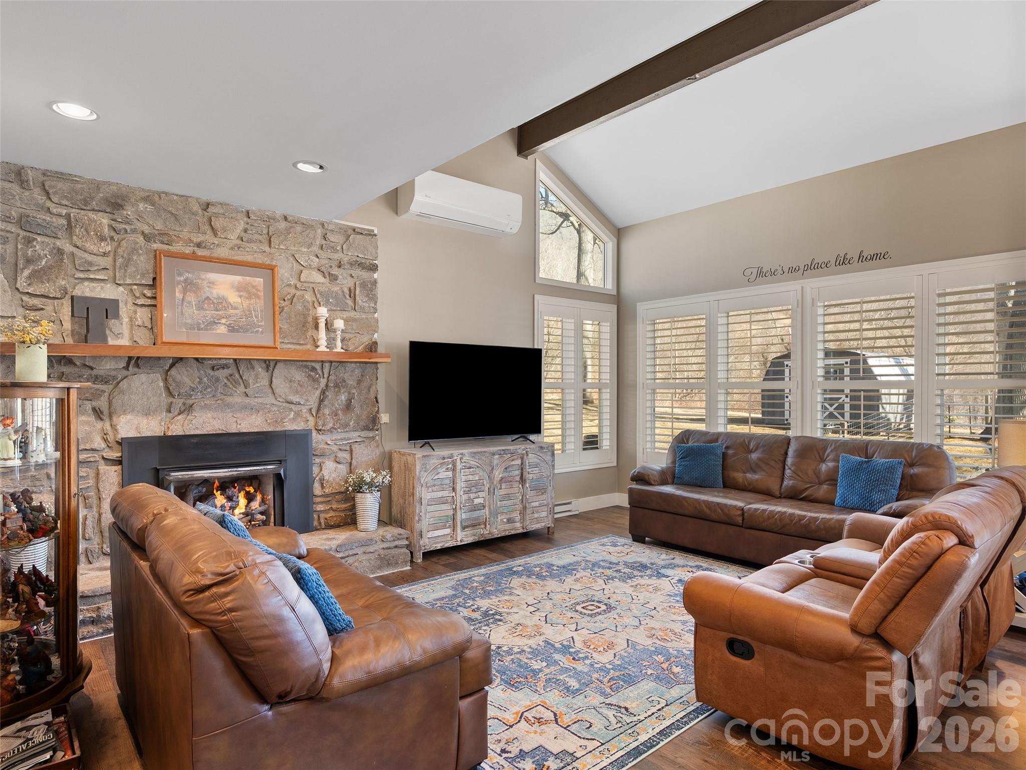 1672 Worley Cove Road Canton, NC 28716 - Photo 12 of 39 a living room with fireplace furniture and a flat screen tv
