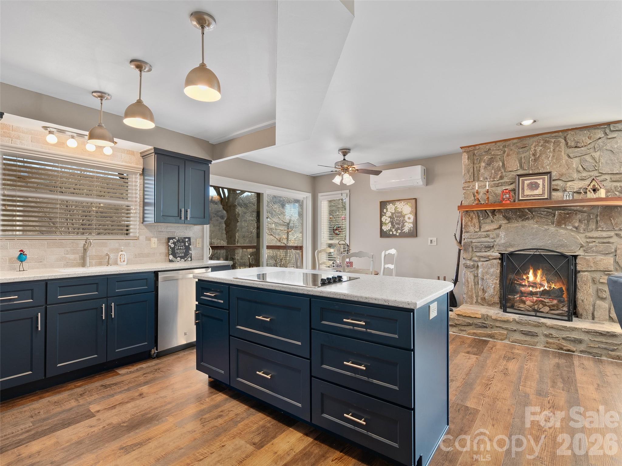 1672 Worley Cove Road Canton, NC 28716 - Photo 20 of 39 a kitchen with a sink and a fireplace